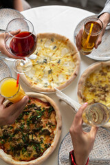 person holding a bowl of pizza