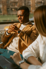 Close up of business man sitting with his colleague