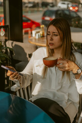 Close up of business girl holding coffee cup