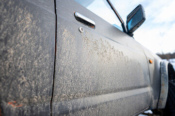 Dirty car side. Splash and texture of mud on a car.