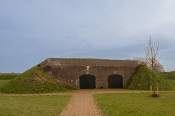 Fototapeta na wymiar bunker in fort wall ramparts of Bastion IX in Muiden near the grounds of Muideslot location of Dutch military significance due to defence structures for Netherlands military to protect the country.
