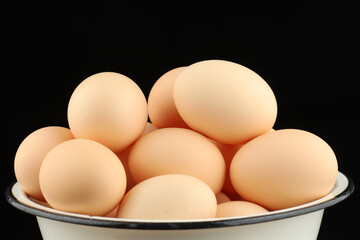 Chicken eggs. A lot of chicken eggs in a bowl.
