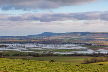 Looking out towards Firle Beacon from the South Downs near Lewes, with flooded fields at Iford inbetween © lemanieh