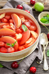 Sweet and healthy fruit soup made of cherries and apples.