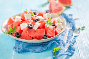 Delicious and healthy watermelon salad with blueberries and nuts. - obrazy, fototapety, plakaty