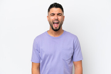 Young Arab handsome man isolated on white background shouting to the front with mouth wide open