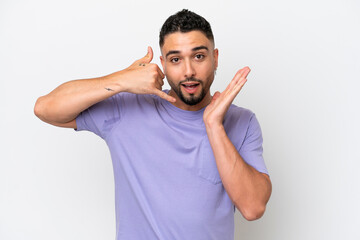 Fototapeta premium Young Arab handsome man isolated on white background making phone gesture and doubting