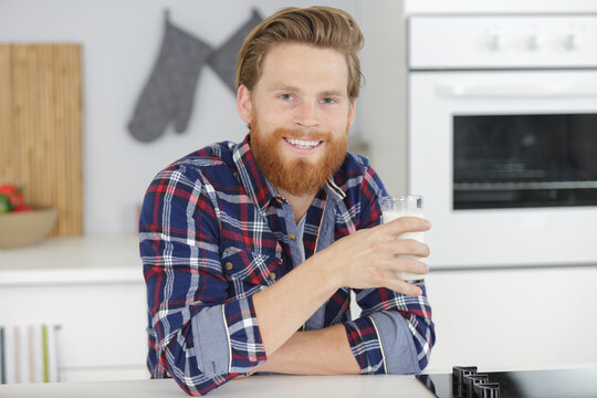 enjoying a glass of milk at home