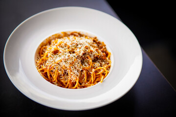 Delicious minced beef spaghetti decorated with parsley on white plate Stock photo