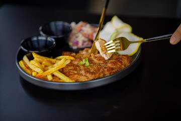 Grilled chicken breast, French fries and vegetabe stock photo