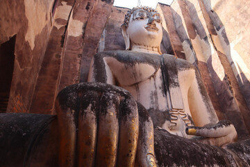 Phra Achana at Wat Si Chum an ancient temple in Sukhothai historical park, Thailand. 