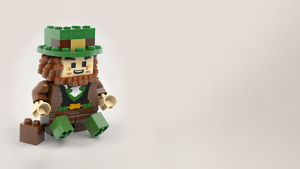 Fototapeta premium 3D Render of Leprechaun Man Made By Building Blocks On Gray Background And Copy Space. St. Patrick's Day Concept.
