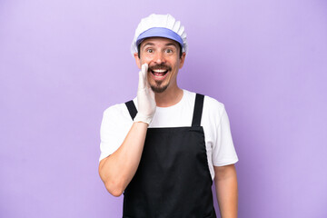 Fishmonger man wearing an apron isolated on purple background shouting with mouth wide open