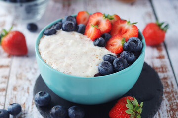 Milk rice with berries ready for breakfast	
