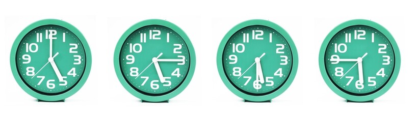 close up of a set of green clocks showing the time; 5, 5.15, 5.30 and 5.45 p.m or a.m. Isolated on white background - obrazy, fototapety, plakaty