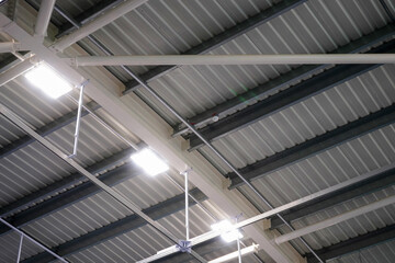 Looking up at a roof of a sports hall