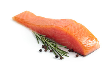 Salmon piece with rosemary and peppercorn isolated on a white background.