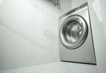 the washing machine is in the bathroom with tile walls