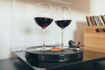 Two glasses of wine swirling on the turntable
