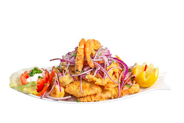 Peruvian traditional food. Fried fish with shrimp, onion, lemon, tomatoes and sauce. Chicharron de pescado