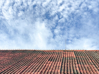 Lightning rod installed on the roof of the building with blue sky background during the day