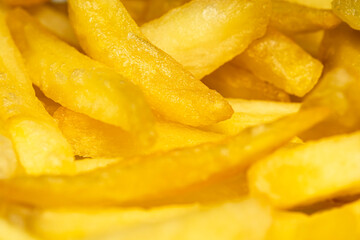 Naklejka na ściany i meble Selective focus, shallow depth of field, macro photography, close up of french fries cut out