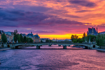 Sunset view of Seine river, Pont du Carrousel in Paris, France. Cityscape of Paris. Architecture and landmarks of Paris - obrazy, fototapety, plakaty
