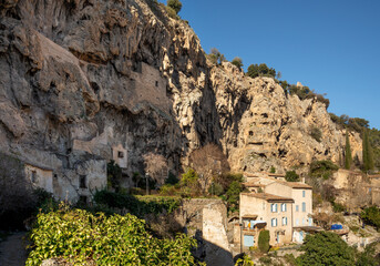 Cotignac is a French village in Provence. It is famous for its troglodyte dwellings that are carved into tufa cliffs covered with large stalactites, and its two feudal towers from 1033.