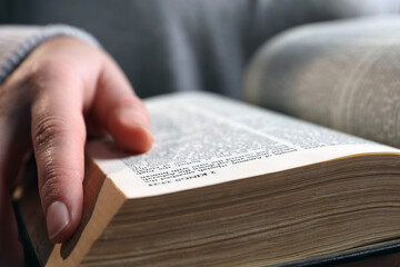 Naklejka premium Woman with old holy Bible, closeup view