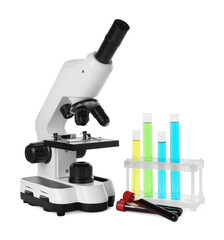 Test tubes with colorful liquids and microscope isolated on white