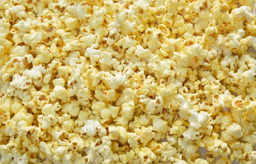 close up of salty popcorn spreading  background and texture
