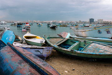Fototapeta na wymiar Harbor of Fishing Boats Floating on Blue Sea Water, Alexandria, Egypt. Africa.