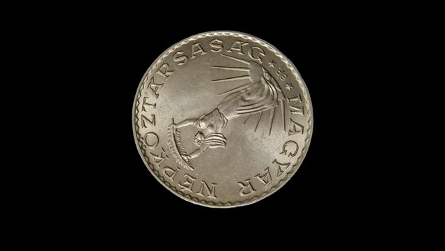 Obverse of old Hungary coin 10 forint with inscription meaning HUNGARIAN PEOPLE'S REPUBLIC, isolated in black background. 4k video