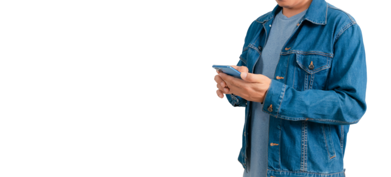 Asian man in shirt and jeans holding mobile phone