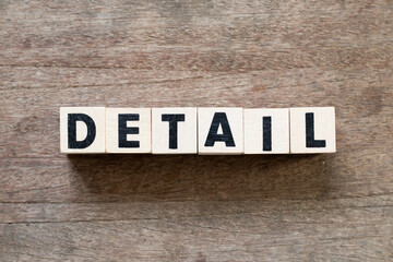 Fototapeta premium Alphabet letter block in word detail on wood background