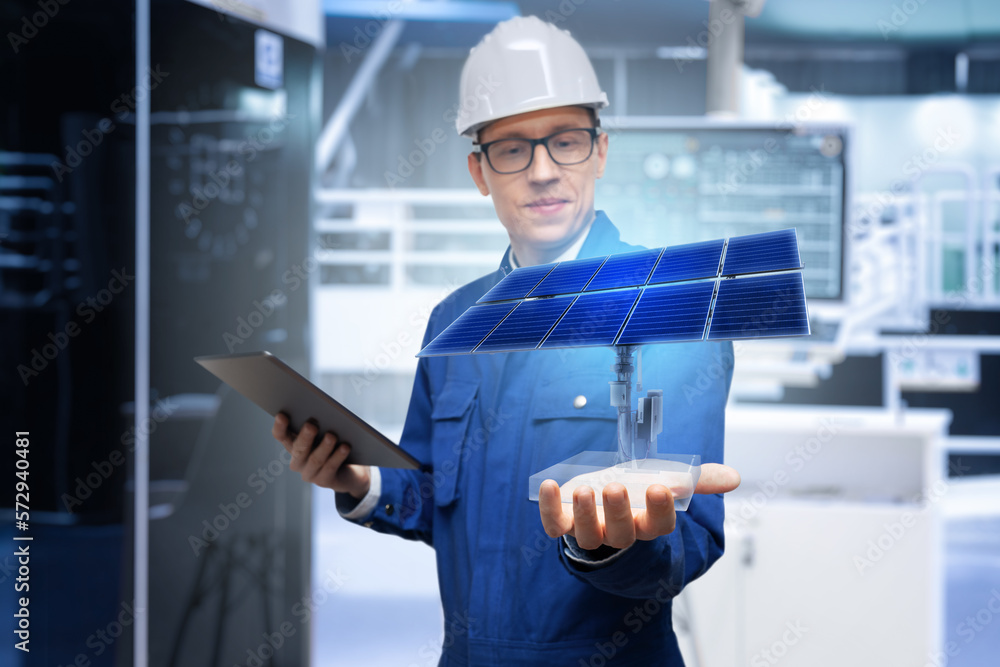 Poster development engineer holds in his hand a model of a solar panel created in augmented reality.