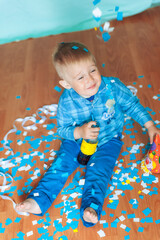 little child playing with toys