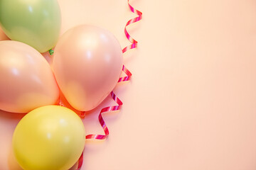 colorful balloons on the pink background, party celebration concept, copy space 