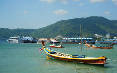 Fototapeta na wymiar Boats Moored in a Bay, Phuket, Thailand.