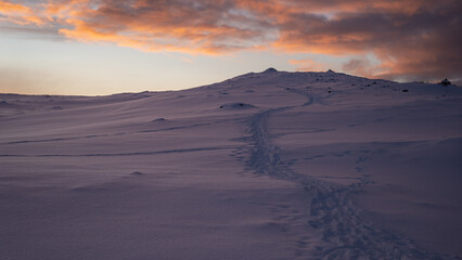 Fototapeta na wymiar Path in snowy mountains