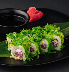 Sushi plate on black stone. japanese food.