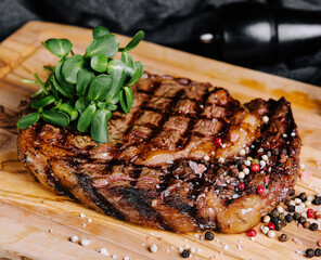 Gourmet grill restaurant steak menu - new york beef steak on wooden background