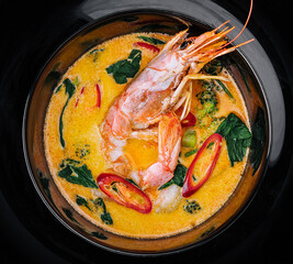 Tom yam is a spicy soup with shrimp. Restaurant soup food.