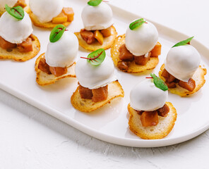 Italian style appetizer on white plate