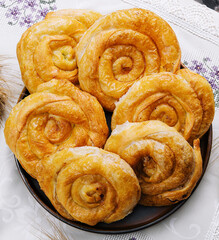 Tasty raising buns on a cloth background