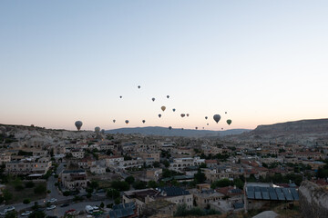 Fototapeta na wymiar Balloons dance in the skies of Cappadocia
