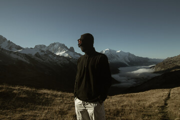 Fototapeta na wymiar person standing on a mountain top