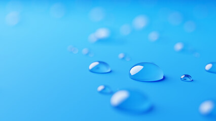 青い背景に複数の水滴。美容液。（横長）	