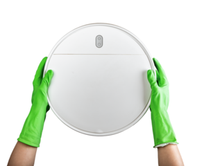 Robot vacuum cleaner in hands in green gloves isolated on white background