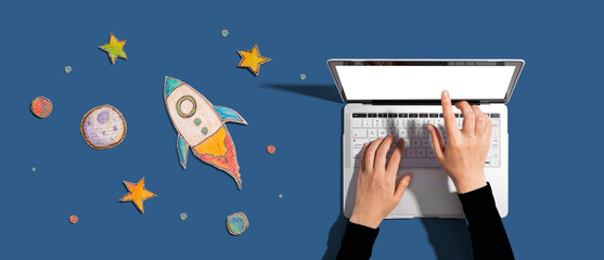 Space exploration theme with a rocket and a laptop